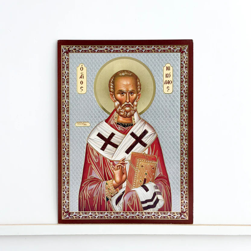 The distinct silver background of this Saint Nicholas icon (8.5 cm X 5.5 cm) ICN